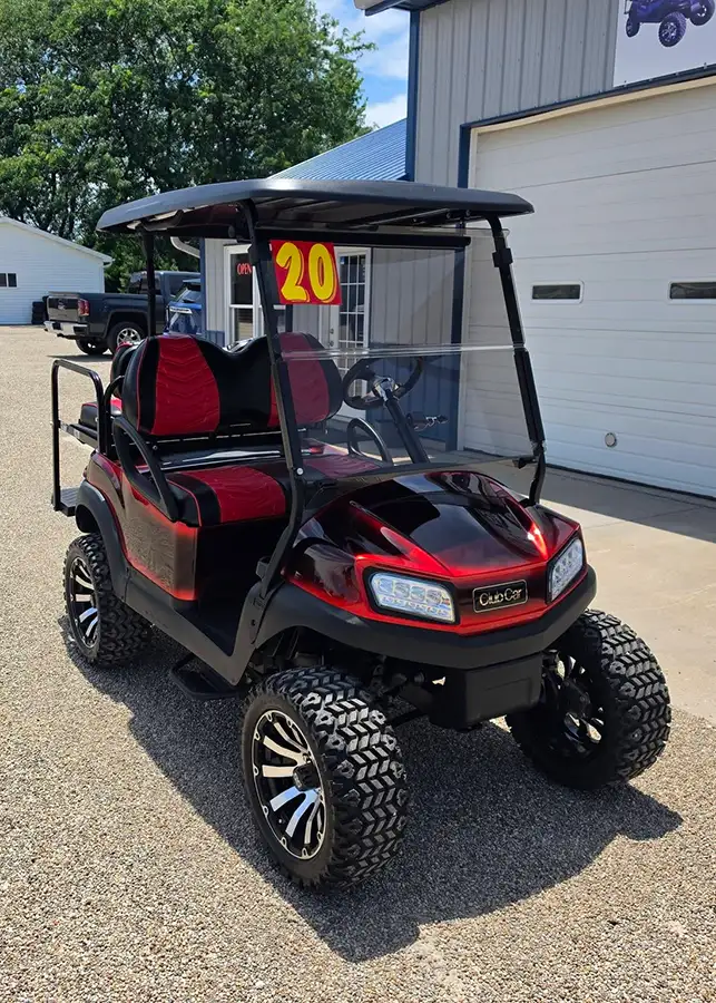 Customized, lifted candy apple red Club Car golf cart with red and black seats for sale at CSC Motor Company near Edwardsville, IL