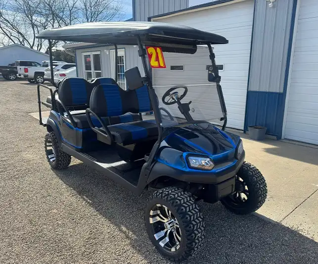 Blue and black lifted six-seater golf cart, customized to be street-legal, with custom wheels available at CSC Motor Company near Edwardsville, IL