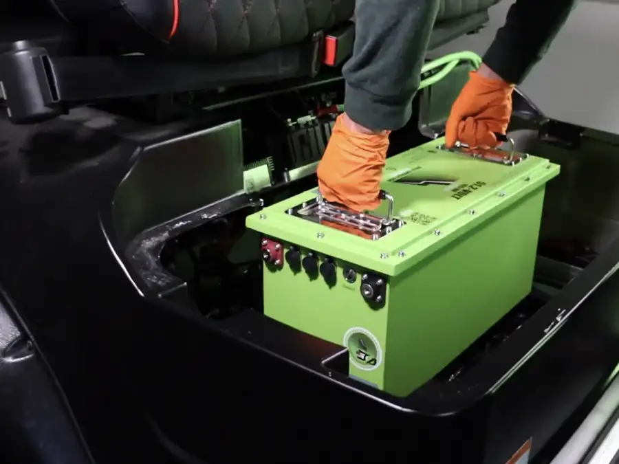 CSC Motor Company technician swapping in a lithium battery pack during a golf cart upgrade near Jacksonville, IL