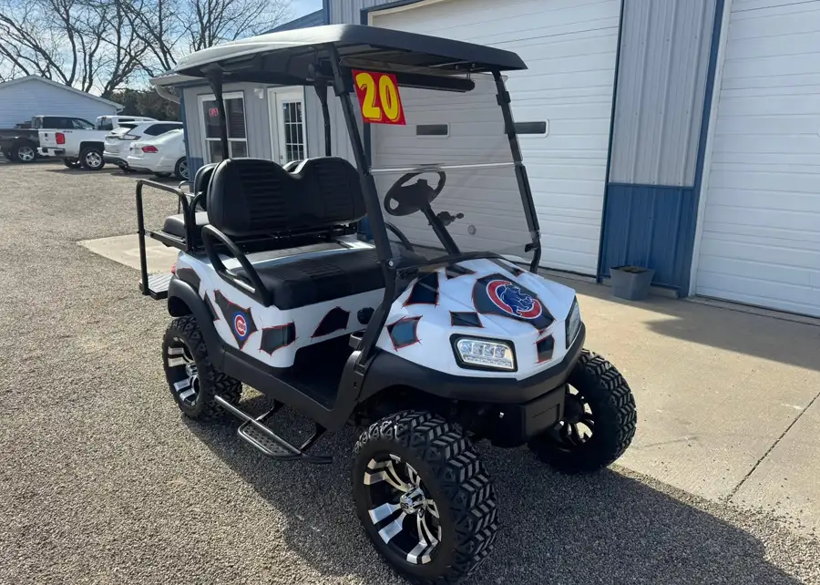 Cubs-branded golf cart wrap with a lift kit and aggressive off-road tires, customized by CSC Motor Company near Litchfield, IL