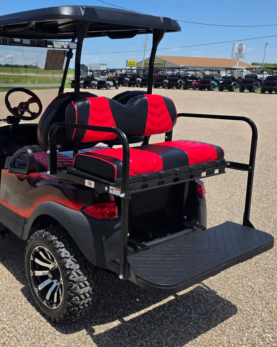 Rear view of red and black golf cart seating with flip-down cargo bed – CSC Motor Company Springfield, IL