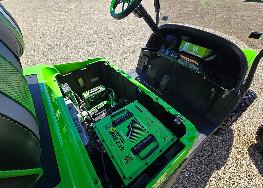 Close-up of lithium battery and wiring installed in green golf cart – CSC Motor Company Springfield, IL
