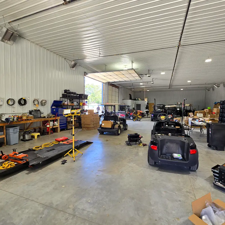 Interior view of CSC Motor Company's golf cart customization shop and workbench near Springfield, IL