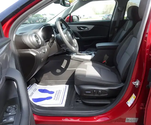 Interior front seats and dashboard of red Chevrolet SUV – CSC Motor Company Springfield, IL